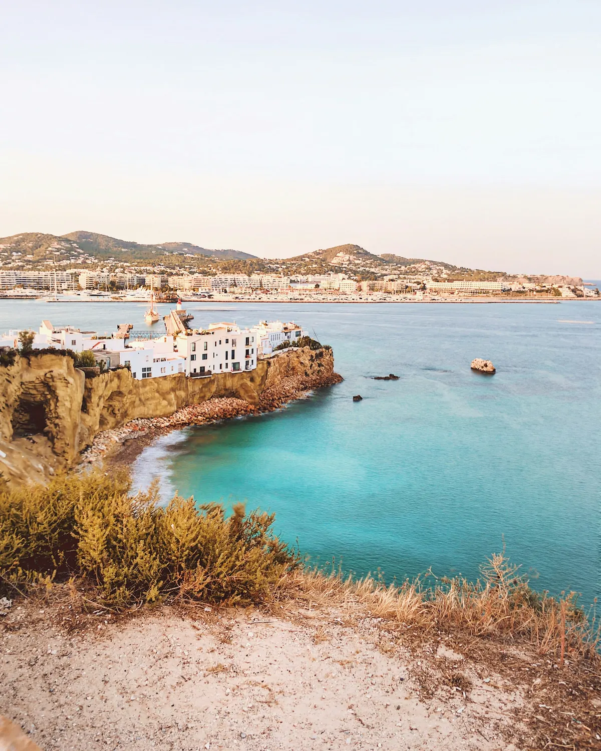Ibiza Town's old walls and harbour above the sea
