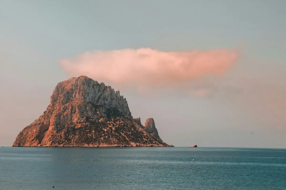 Es Vedra under a pink evening sky